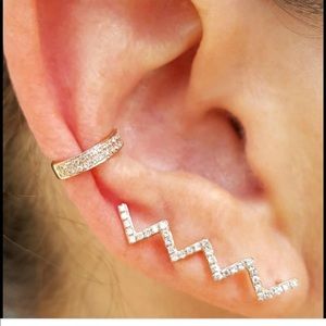 Gold pave diamond climber earrings.